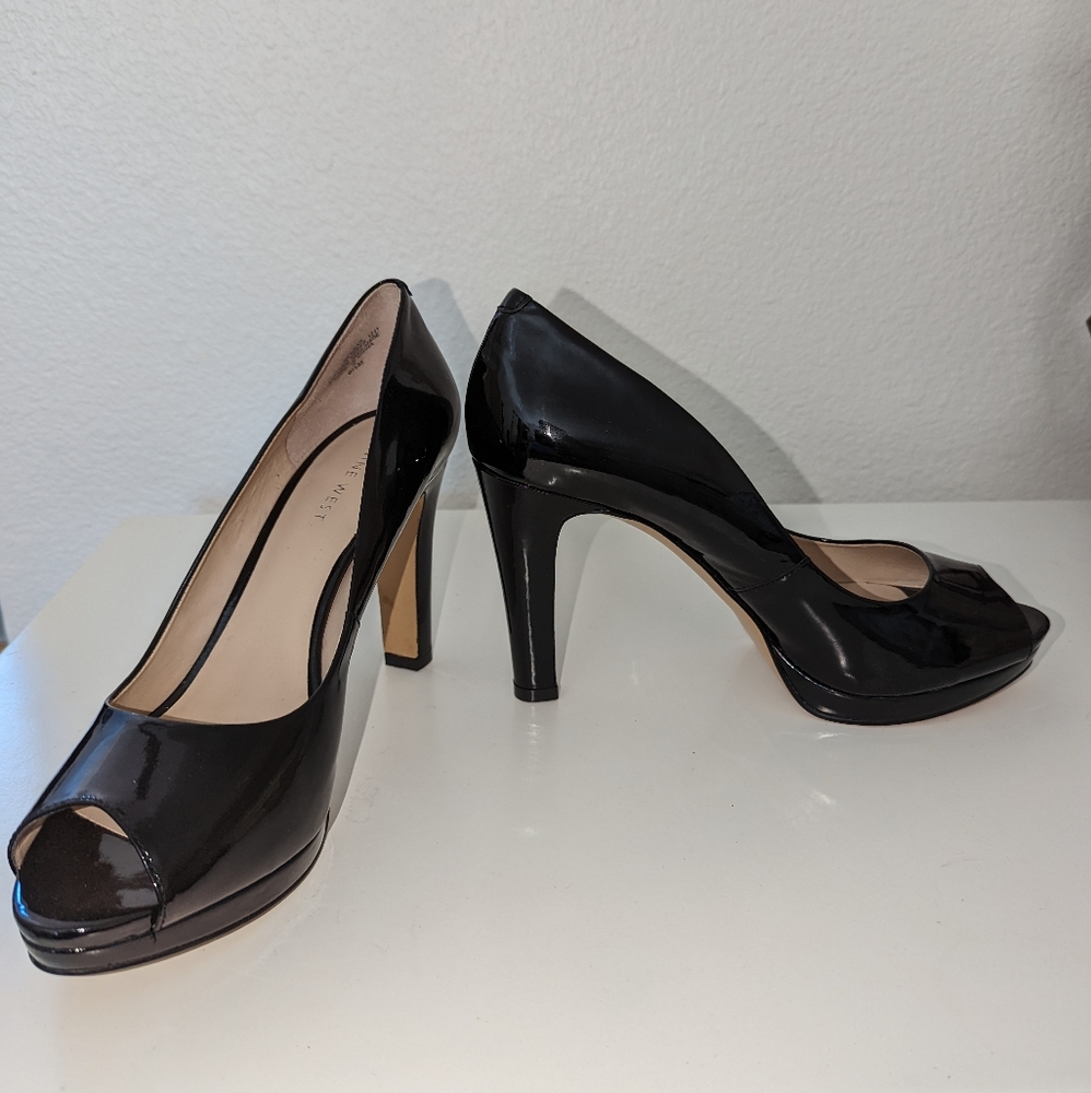Nine West black 4 inch peep toe heels with about 0.5 inch platform. Size 8.5.